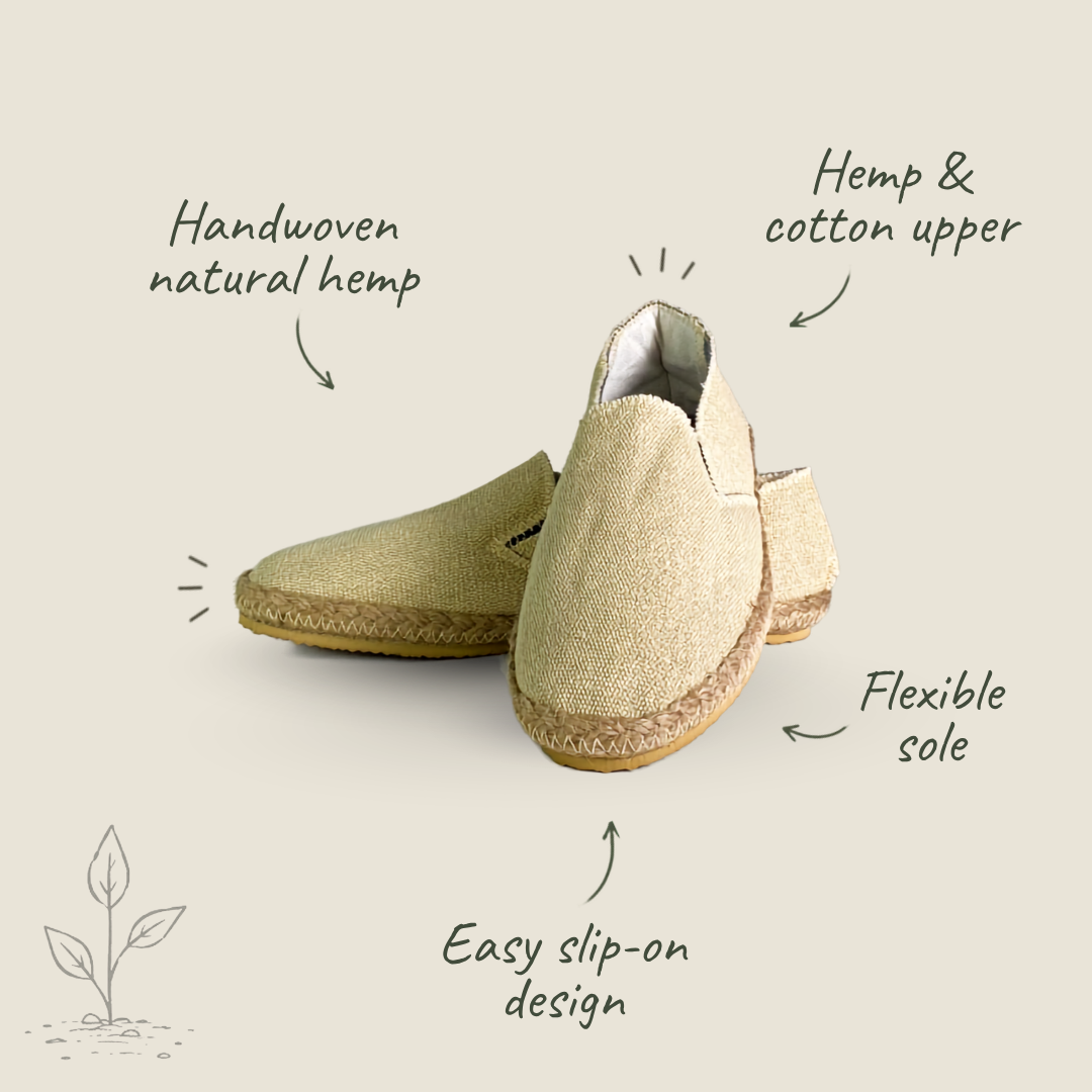 A pair of slip-on espadrille-style shoes in a natural beige tone, shown with handwritten callout labels pointing to features like handwoven natural hemp, hemp and cotton upper, flexible sole, and easy slip-on design, on a light warm beige background.